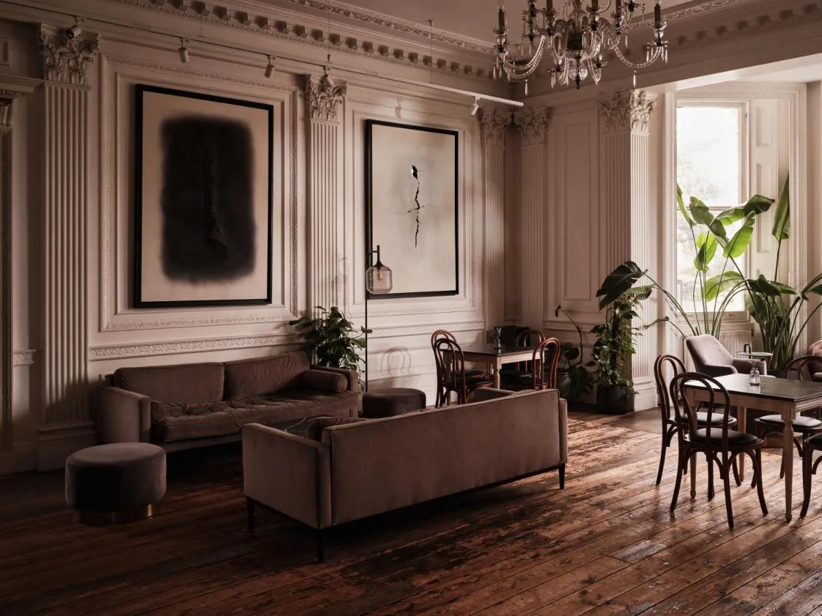 A comfortable living room with a couch and table at The Columbia, London