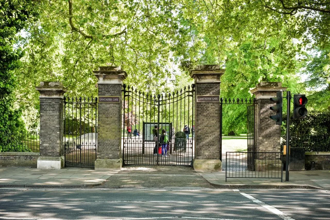 The black entrance gate with traffic light outside The Columbia Hotel